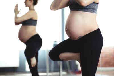 Pregnant woman doing yoga, busting one of the pregnancy myths in this blog | CU Medicine OB-GYN East Denver (Rocky Mountain) | Denver, CO