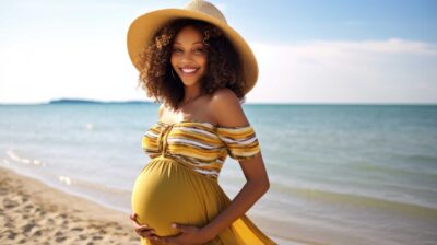 Pregnant woman enjoys a beach vacation after discussing safely traveling during pregnancy with her OB-GYN | CU OB-GYN East Denver