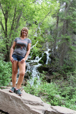 uterine fibroids | CU Medicine OB-GYN East Denver (Rocky Mountain) | patient Lisa poses by waterfall